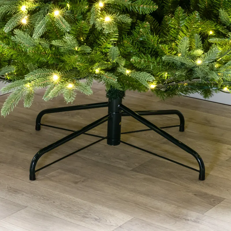 The folding metal stand under the base of the tree