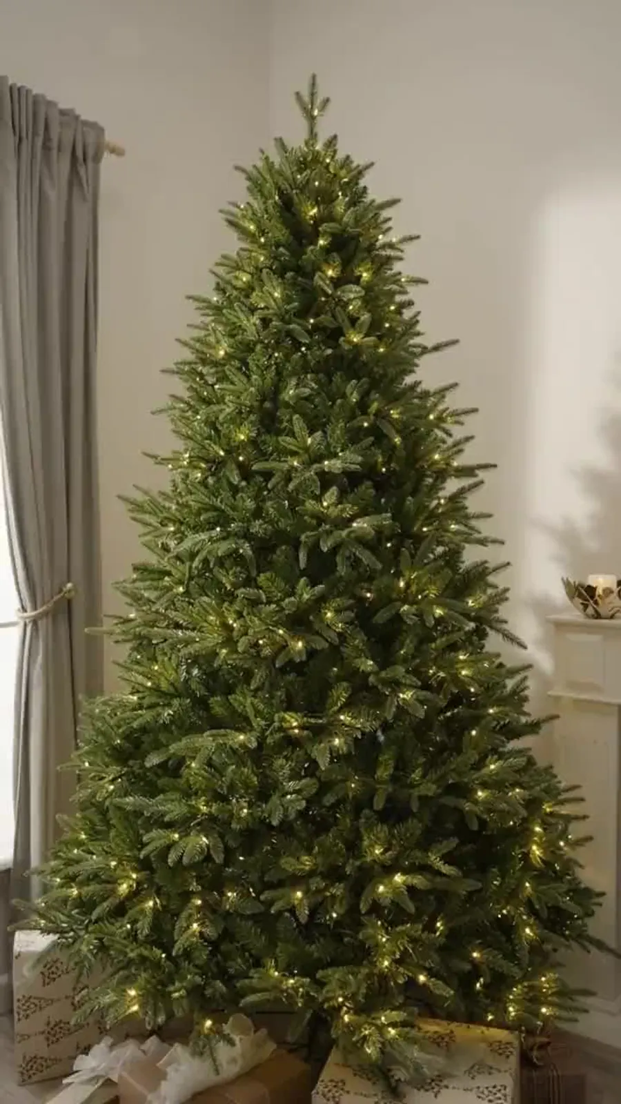 The assembled tree lit in a room corner