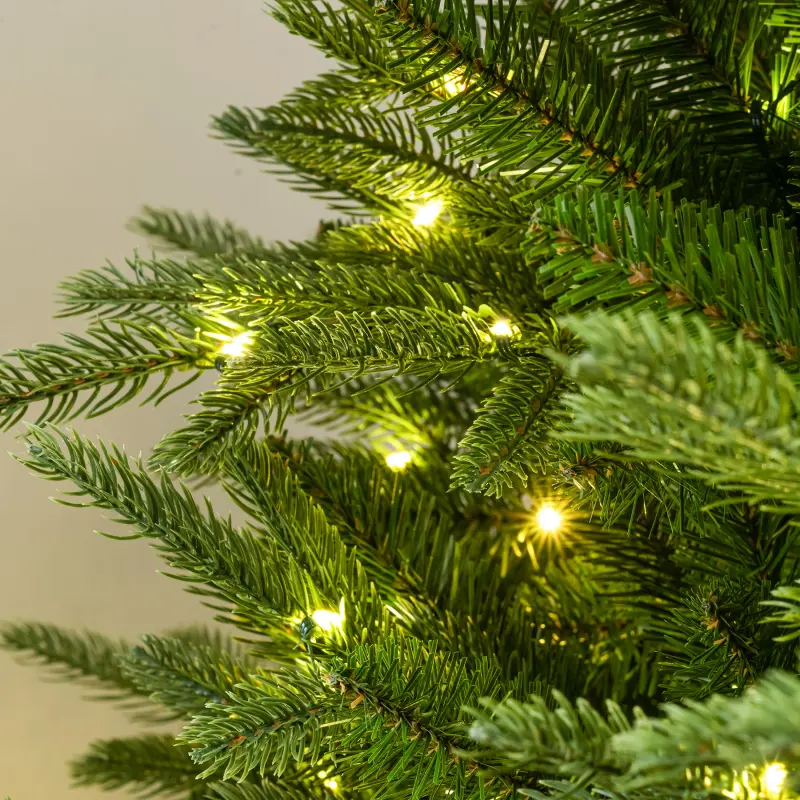 Warm-white LED bulbs woven through the branch tips